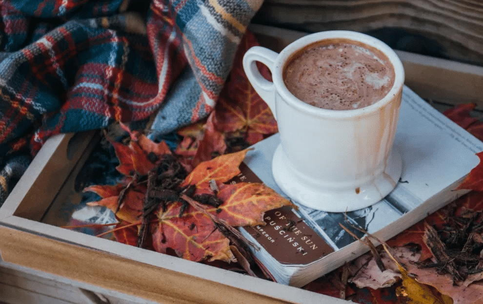 hot chocolate on the top of a book